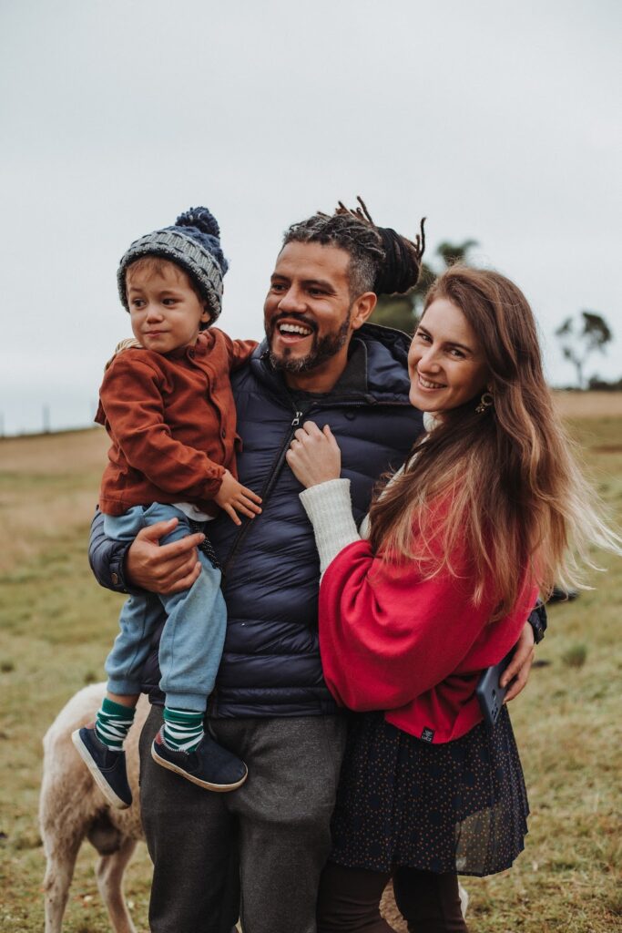 Family: mother, father is holding his son outdoors