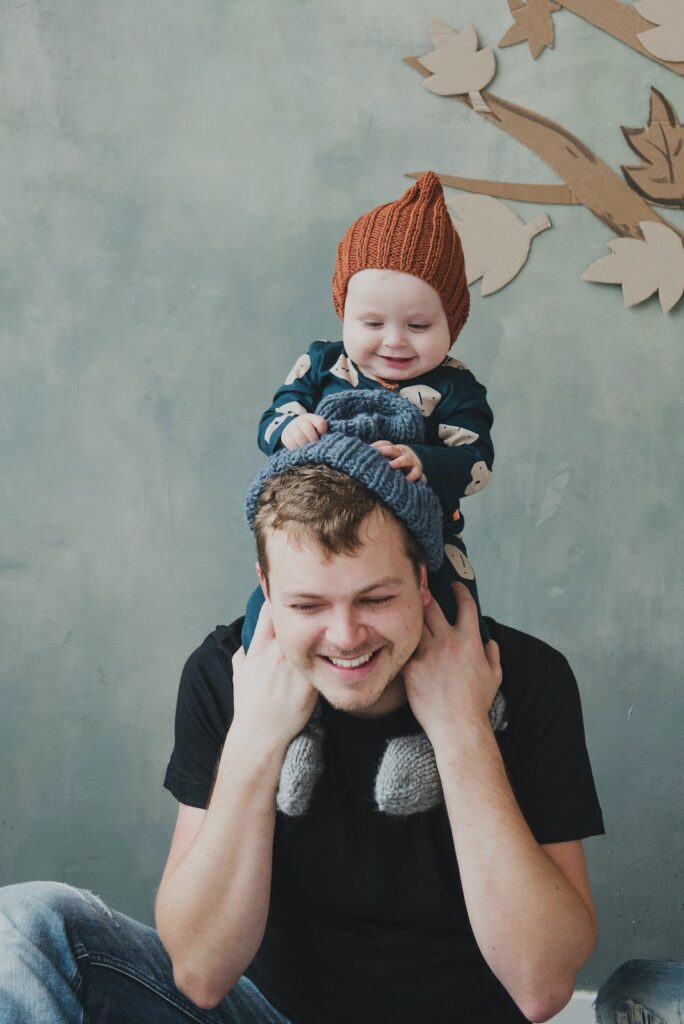 father with his daughter on the neck.